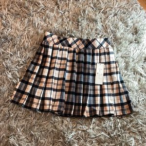Cute pink and black plaid skirt.